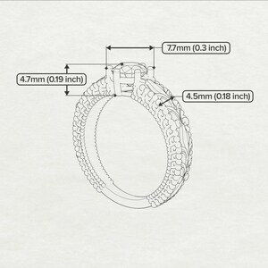 May include: A silver ring with a round, clear gemstone set in a prong setting. The band is decorated with a textured design. The ring measures 7.7 mm (0.3 inch) wide and 4.5 mm (0.18 inch) high.