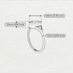 May include: A silver ring with a round, bezel-set gemstone. The ring is 8.8mm (0.35 inches) wide and 3.9mm (0.15 inches) tall. The band is 1.3mm (0.05 inches) thick.