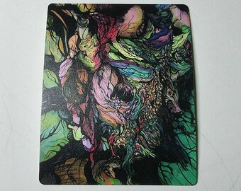 May include: Abstract art print with a colorful, swirling design featuring shades of green, blue, pink, and red. The design resembles a face with intricate details.