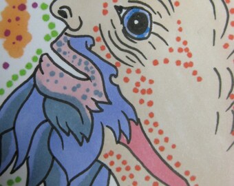 May include: A whimsical illustration of a creature's face, featuring a light beige complexion with red spots. The creature has blue eyes, a blue and purple beard, and a pink throat. The background is white with colorful dots.