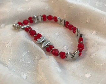 Czech Glass Bracelet: Red Oval Faceted Beads with Silver Tinos