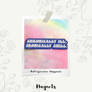 May include: A refrigerator magnet with the text "Chronically Ill, Ironically Chill" in a retro font. The magnet has a blue border with rainbow-colored text and is set against a pastel tie-dye background.