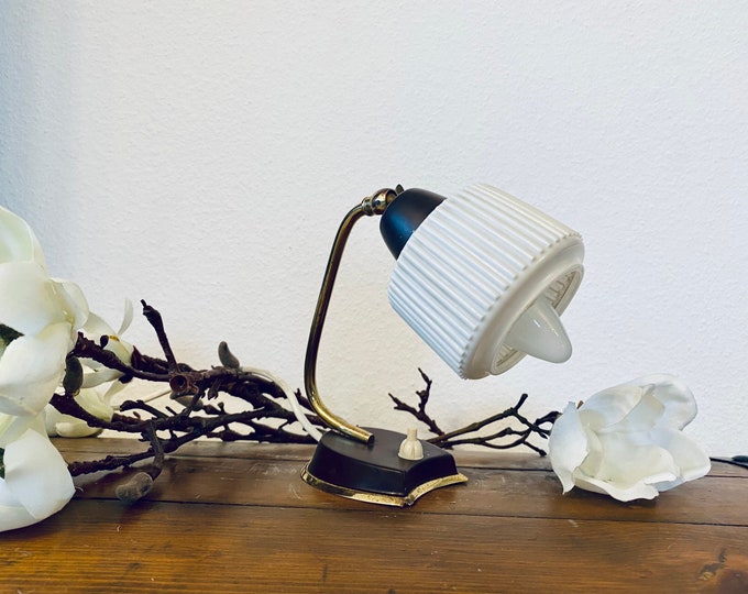 Stylish night table lamp from the 50s made of plastic and metal.