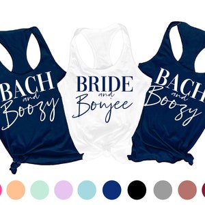 May include: Three tank tops with white text on a navy blue background. The text on the tank tops reads "Bach and Boozy", "Bride and Bonjee", and "Bach and Boozy".