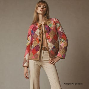 May include: A colorful patchwork jacket with a brown trim and decorative closures. The jacket features a variety of diamond-shaped fabric pieces in shades of pink, red, orange, and green. The model is wearing beige pants and a brown belt.
