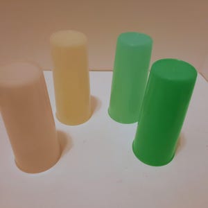 May include: A set of three ceramic mugs with a speckled, matte finish. The mugs are in shades of cream, light gray, and dark gray. Each mug has a simple, minimalist design, perfect for coffee or tea.