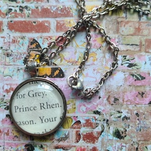Prince Rhen pendant necklace made with A Curse So Dark and Lonely book pages