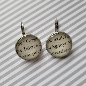 Tairn and Sgaeyl pendant earrings made with Fourth Wing book pages