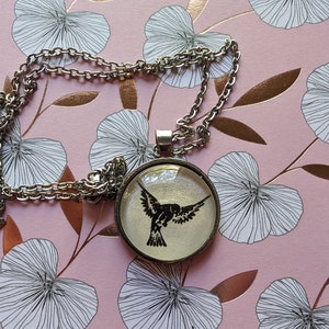 Starling pendant necklace made with Starling House book pages