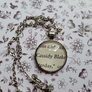 Cassidy Blake pendant necklace made with City Of Ghosts book pages