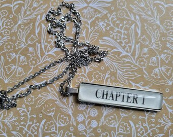 Chapter One rectangle pendant necklace made with book pages