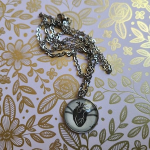 Nina Zenik Symbol 20mm pendant necklace made with King of Scars book pages