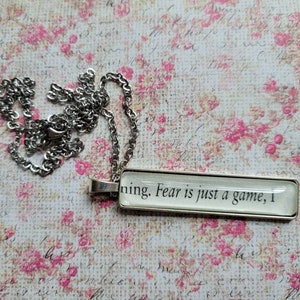 Fear is Just a Game pendant necklace made with Six Crimson Cranes book pages