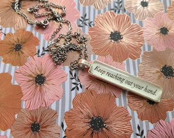 Keep Reaching Out Your Hand pendant necklace made from Court of Silver Flames book pages