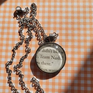 Team Nash pendant necklace made with Things We Hide From the Light book pages