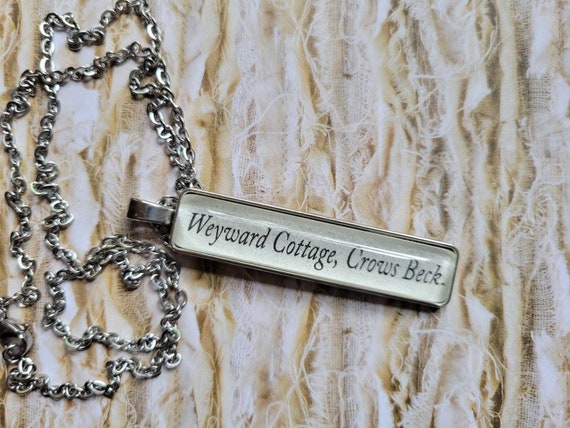 Crows Beck pendant necklace made with Weyward book pages
