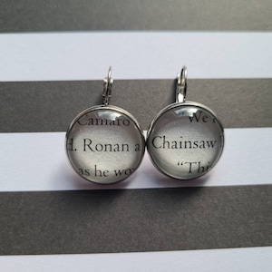 Ronan and Chainsaw pendant earrings made with Raven Boys book pages