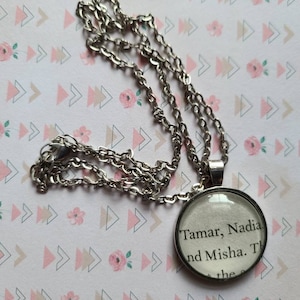 Tamar and Nadia pendant necklace made with Shadow and Bone book pages