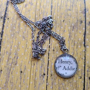 Henry and Addie 20mm pendant necklace made with Invisible Life of Addie LaRue book pages