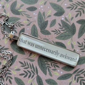Unnecessarily Awkward pendant necklace made with Icebreaker book pages