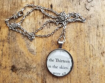 The Thirteen pendant necklace made with Throne of Glass book pages