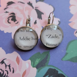 Addie and Zade pendant earrings made with Haunting Adeline book pages