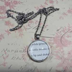 Little Mouse pendant necklace made with Haunting Adeline book pages