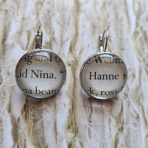 Nina and Hanne pendant earrings made with King of Scars book pages