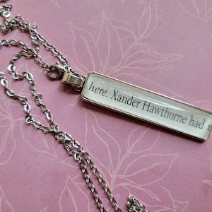 Xander Hawthorne pendant necklace made with The Inheritance Games book pages