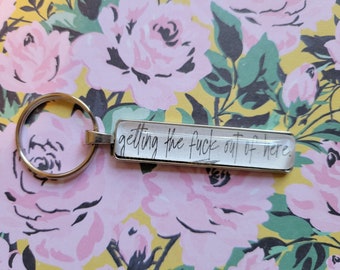 Getting Out of Here key chain made with Haunting Adeline book pages