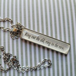 Ring Out the Old pendant necklace made with Christmas By The Book book pages