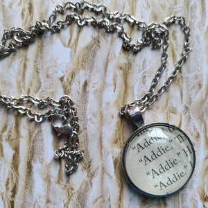 Addie pendant necklace made with Invisible Life of Addie LaRue book pages