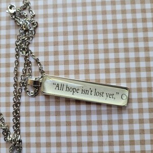 All Hope Isn&#39;t Lost necklace made with First to Die at the End book pages