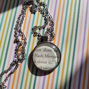 Nash Morgan pendant necklace made with Things We Hide From the Light book pages