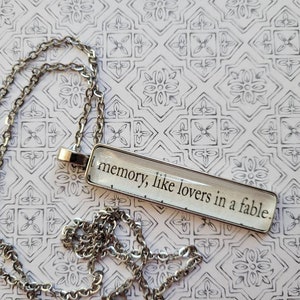 Memory pendant necklace made with Invisible Life of Addie LaRue book pages