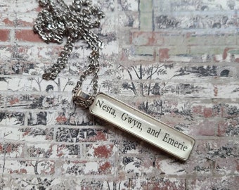Nesta Emerie and Gwyn pendant necklace made from Court of Silver Flames book pages