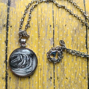 One Forgotten Night pendant necklace made with Invisible Life of Addie LaRue book pages