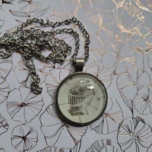 Knight pendant necklace made with Assistant to the Villain book pages