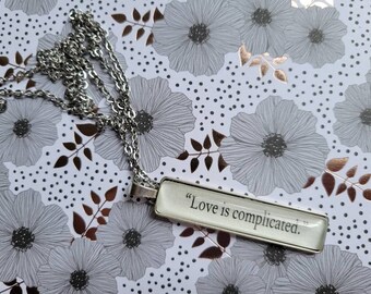 Love is Complicated pendant necklace made from Court of Silver Flames book pages