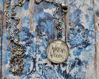 Wren's Woods 20mm pendant necklace made with The Stolen Heir book pages