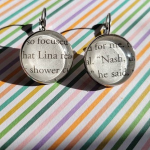 Lina and Nash pendant earrings made with Things We Hide From the Light book pages
