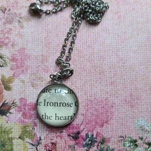 Ironrose 20mm pendant necklace made with A Curse So Dark and Lonely book pages