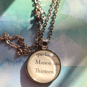 Manon and The Thirteen pendant necklace made with Throne of Glass book pages