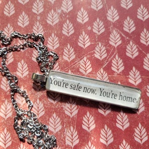 Home Safe pendant necklace made with These Hollow Vows book pages