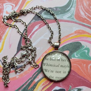 Whimsical Maybe pendant necklace made with Maggie Moves On book pages