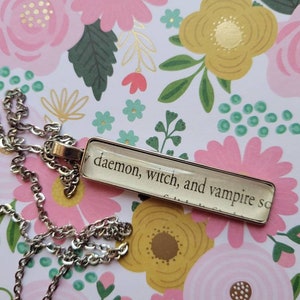 Daemon Witch Vampire pendant necklace made with Discovery of Witches book pages