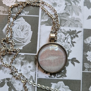 Red Lips pendant necklace made with Haunting Adeline book pages