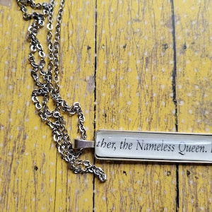 The Nameless Queen pendant necklace made with Six Crimson Cranes book pages