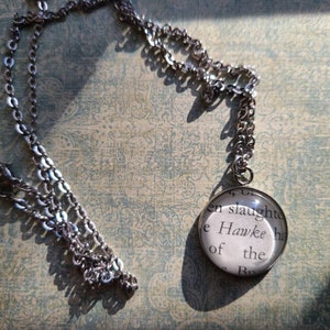 Hawke Flynn 20mm pendant necklace made with From Blood and Ash book pages