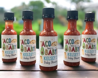 May include: Five small bottles of hot sauce with labels that say "Taco Bout A Baby! Kelsey's Baby Shower".